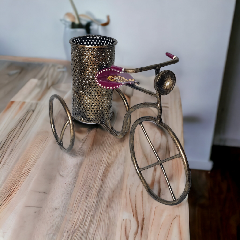 a metal cup sitting on top of a wooden table